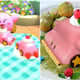 Pictured are in-game and real-world version of the Kirby Mouthful Mode car cake.